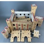 A wooden toy fort, keep 42 x 37 x 34cm.