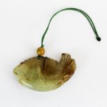 A Chinese carved jade fish amulet, L. 7cm.