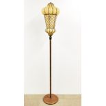 An interesting copper standard lamp with wrought iron bubble design glass shade, H. 176cm.