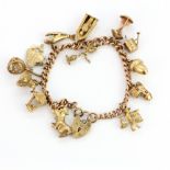 A heavy 9ct yellow gold charm bracelet.