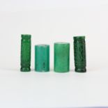 Four Chinese carved jade/hardstone beads, longest 4.5cm.