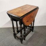 A 20th century oak drop leaf table, extended L. 88cm W. 61cm H. 71cm. One fold out leg detached.