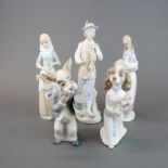 A group of five Nao porcelain figurines, tallest H. 30cm.