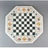 A Pietra dura marble chess board, W. 38cm.