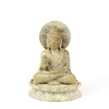 An Eastern carved stone figure of a seated Buddha, H. 13cm.