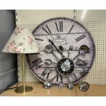 Two kitchen clocks and a table lamp.