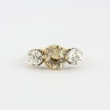 A hallmarked 18ct yellow gold ring set with a large brilliant cut brown diamond, approx. 1.45ct, and