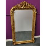 A heavy quality carved gilt painted mirror, 157 x 80cm.