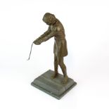 A mid-20th Century bronze figure of a woman golfer on a metal and stone base, H. 32cm. Golf club