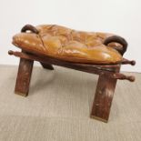 A hardwood button stool with inlaid brass decoration, 76 x 40cm. Damage to buttons and fabric.