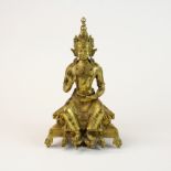 A Tibetan jewelled gilt bronze figure of a seated Buddha, H. 23cm.