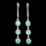 A pair of 925 silver drop earrings set with oval cut emeralds and black spinels, L. 4.7cm.