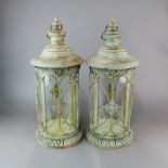A pair of painted and gilt metal storm lanterns, H. 57cm.
