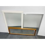 A group of three useful framed mirrors, largest 104 x 75cm.