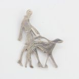 A large hallmarked 925 silver Art Deco brooch of a lady walking her dog, L. 7cm.