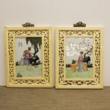 A pair of Chinese hand painted porcelain panels in painted carved hard wooden frames, frame size