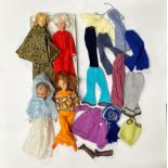 A group of Sindy dolls and accessories.