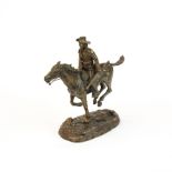 A small Remington style bronze of a cavalry scout, H. 16cm.