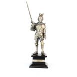 A 925 hallmarked silver (filled) figure of a medieval knight on a wooden stand, H. 21cm.