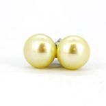 A pair of cream cultured pearl stud earrings, Dia. 8mm.