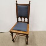 A 20th century oak re-upholstered hall chair, H. 110cm.