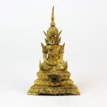 An early 20th century Siamese gilt bronze figure of a seated buddha, H. 16cm.