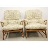 A pair of Ercol upholstered armchairs.