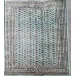 A large green ground wool rug, 280 x 380cm.