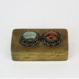 A Chinese hinged brass stamp box inset with agate and jade, 8 x 4.5 x 2cm.