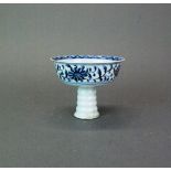 A Chinese hand painted porcelain stem cup with inside relief decoration, H. 10cm. Dia. 12cm.
