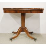 An early 19th century rosewood veneered pedestal fold out games table, W. 92cm.