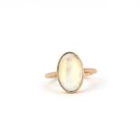 A rose metal ring set an oval cabochon moonstone, (G.5).