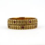 A hallmarked 9ct yellow gold and ruby set ring, (P).