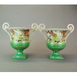 A pair of Continental porcelain two handled vases featuring hunting, H. 24cm.