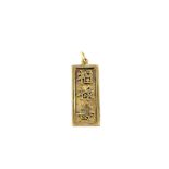 An 18ct yellow gold pendant with Chinese characters in relief, L. 3.3cm.