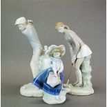 Two Lladro figures of golfers with a further Lladro figure, tallest 27cm.