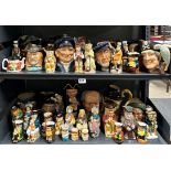 An extensive collection of Royal Doulton and other character jugs with two reference books.