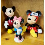 Two Disney articulated Mickey Mouse toys together with a Royal Doulton Mini Mouse.