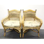 A pair of cane armchairs.