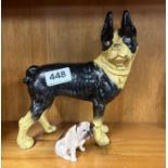 A painted cast iron dog door stop, H. 20cm, together with a Royal Doulton pug dog.