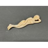 A Chinese carved bone medicine figure, L. 12.5cm.