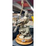 A resin and wood bird table lamp, H. 50cm.