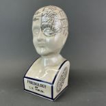 A ceramic phrenology head, H. 39cm.