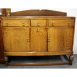 A 1930's oak sideboard, W. 136cm.