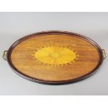 An Edwardian inlaid mahogany tea tray with gilt brass handles, W. 73cm.