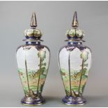 A pair of impressive Continental porcelain jars and covers, H. 50cm.