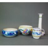 A group of four Poole pottery items, candlestick H. 24cm. Small chip restoration on candlestick.