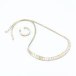 A 14ct tri colour gold necklace with a matching 9ct tri colour gold hoop earring.