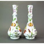 A pair of Continental porcelain vases decorated with flowers and insects. H. 33cm.
