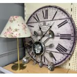 Two kitchen clocks and a table lamp.